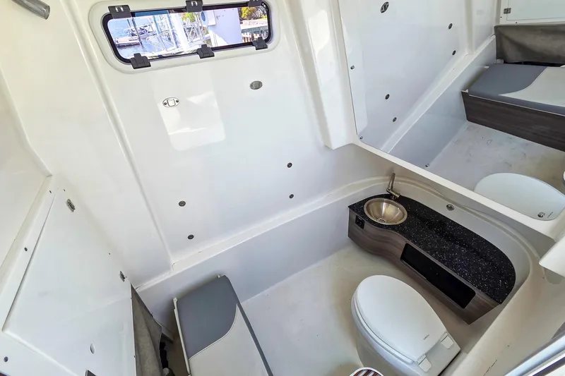Slide: The Image of Interior of 2021 Sea Pro 320 DLX Offshore boat with modern bathroom amenities. - 4