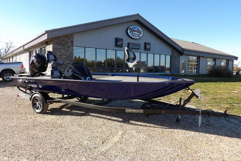 The Image of 2026 Crestliner XF 189 boat on trailer outside marine center. - 1