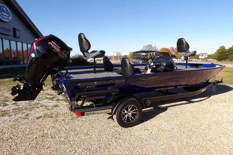 Slide: The Image of 2026 Crestliner XF 189 boat with motor, parked outdoors on gravel. - 11