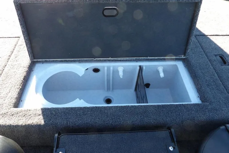 Slide: The Image of 2026 Crestliner XF 189 boat storage compartment with open lid, showcasing interior design. - 12