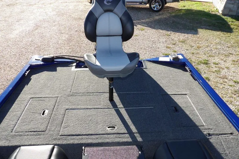 Slide: The Image of 2026 Crestliner XF 189 boat interior with swivel seat and carpeted deck. - 14