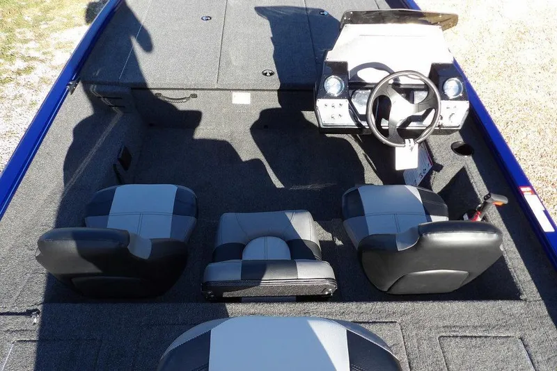 Slide: The Image of 2026 Crestliner XF 189 boat interior with steering console and seating arrangement. - 16