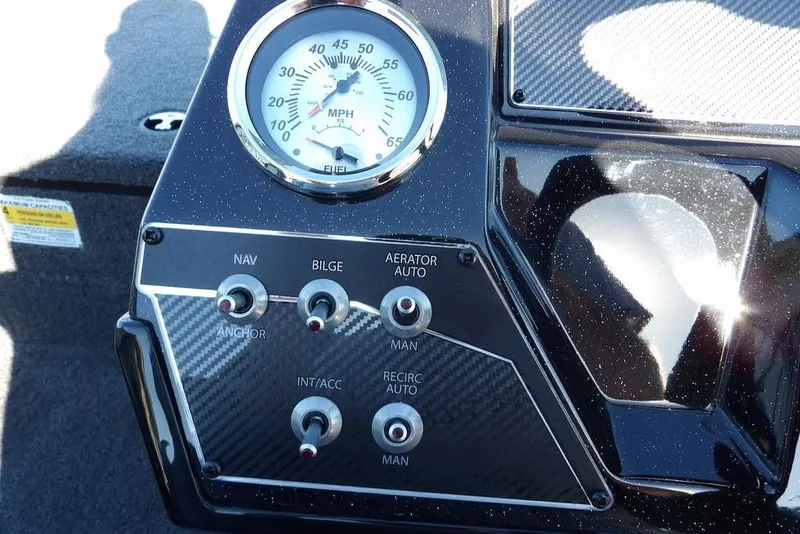 Slide: The Image of Dashboard of 2026 Crestliner XF 189 boat with speedometer and control switches. - 17