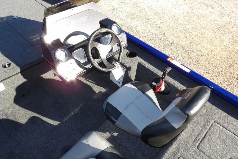 Slide: The Image of 2026 Crestliner XF 189 boat interior with steering wheel and seating. - 18