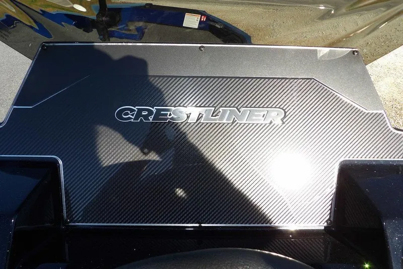 Slide: The Image of 2026 Crestliner XF 189 boat with carbon fiber detailing and logo. - 19