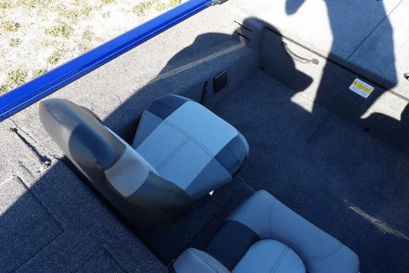 Slide: The Image of 2026 Crestliner XF 189 boat interior with gray seating and carpeted flooring. - 23