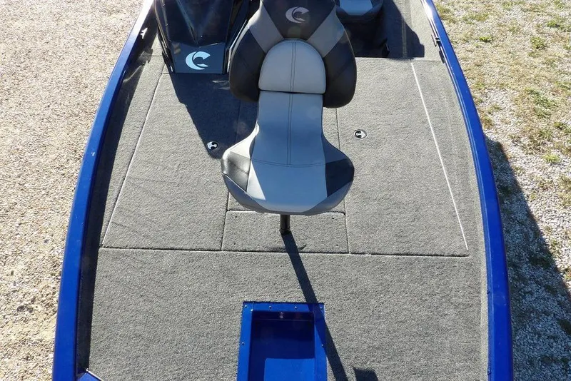 Slide: The Image of 2026 Crestliner XF 189 boat interior with gray seating and carpeted deck. - 33