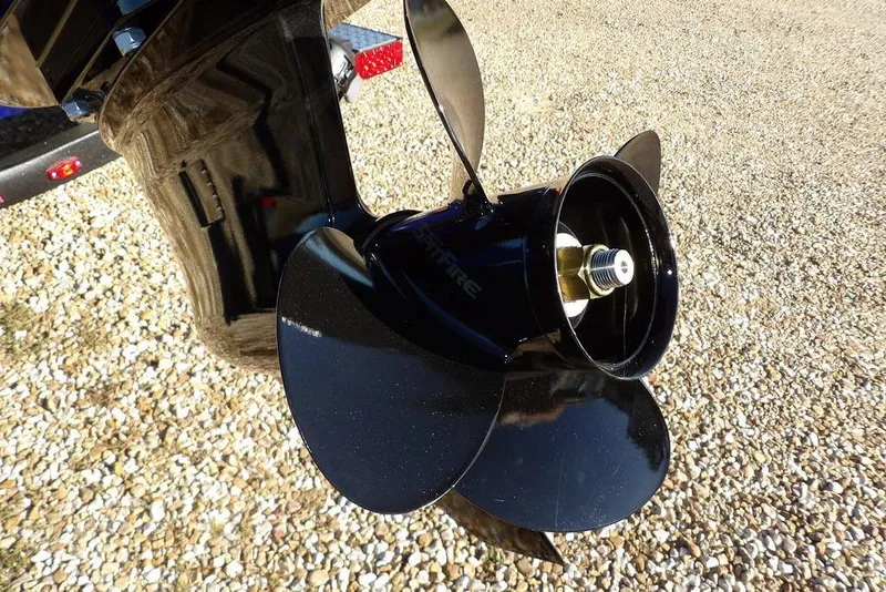 Slide: The Image of Propeller of 2026 Crestliner XF 189 boat on gravel surface. - 40
