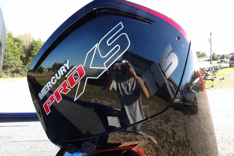 Slide: The Image of Mercury Pro XS engine on 2026 Crestliner XF 189 boat, reflecting outdoor scenery. - 42