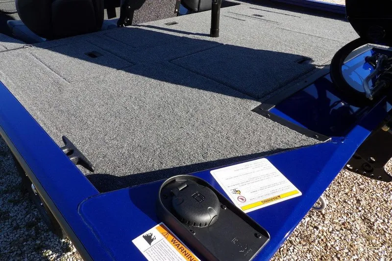 Slide: The Image of 2026 Crestliner XF 189 boat deck with gray carpet and blue trim. - 7