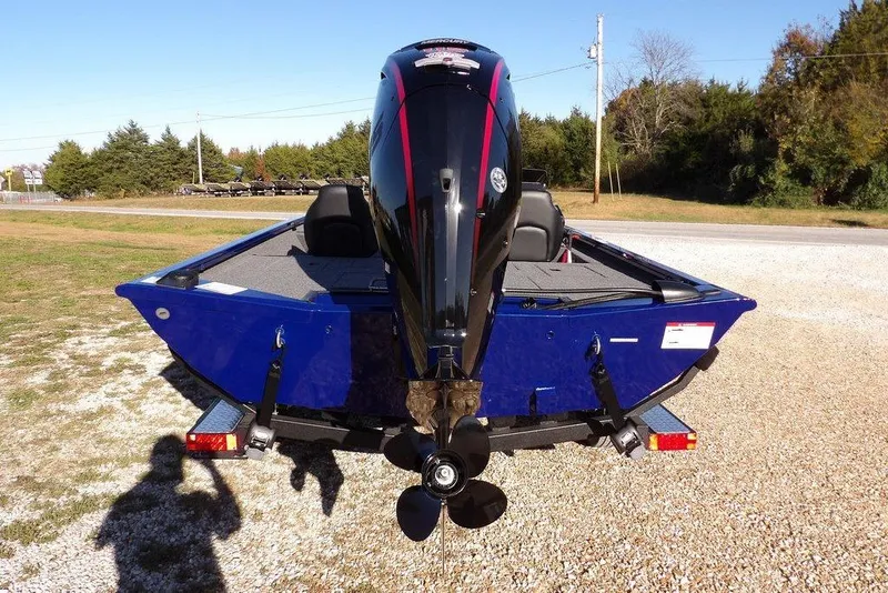 Slide: The Image of 2026 Crestliner XF 189 boat with powerful outboard motor, parked on gravel. - 9
