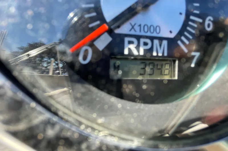 Slide: The Image of Close-up of a 2015 NauticStar 203SC Sport Deck RPM gauge showing 3948 RPM. - 7