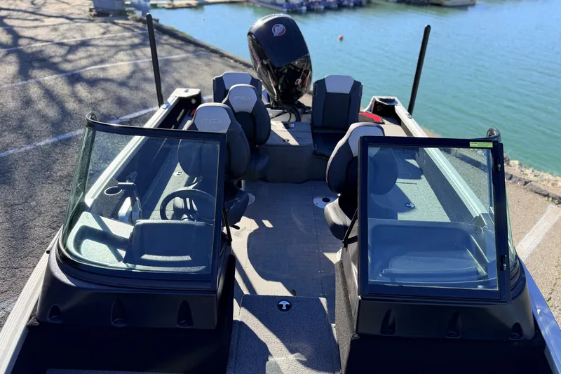 Slide: The Image of 2024 Alumacraft Competitor 175X Sport boat interior with dual consoles and seating. - 11