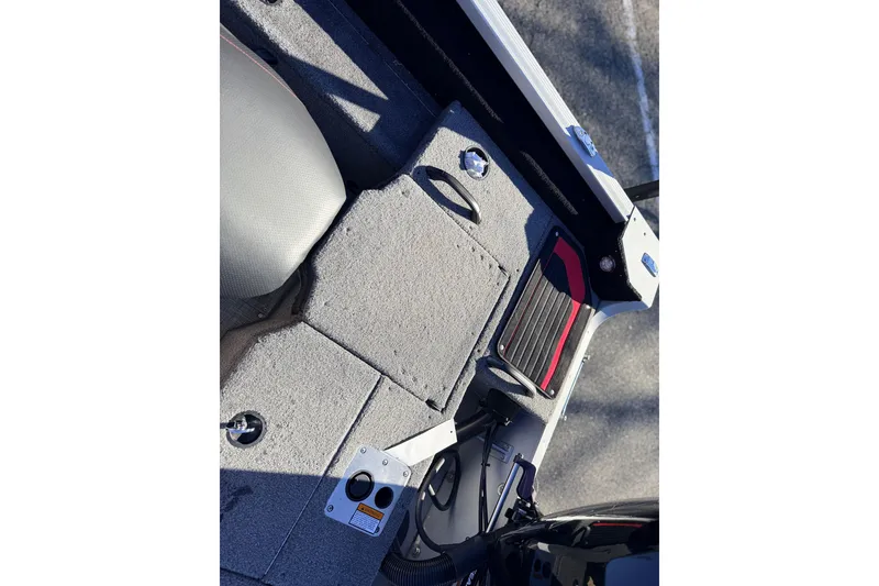 Slide: The Image of 2024 Alumacraft Competitor 175X Sport boat interior with seating and storage compartments. - 14