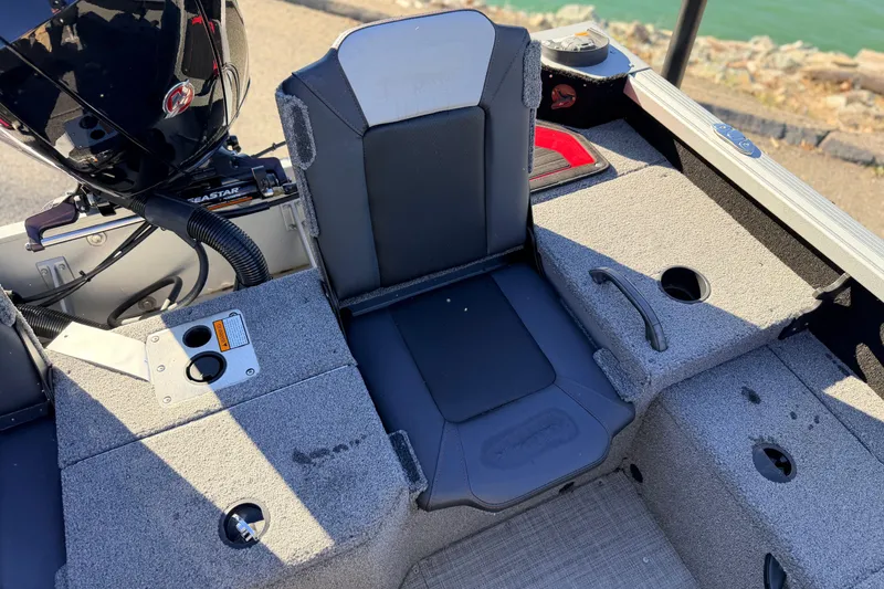 Slide: The Image of 2024 Alumacraft Competitor 175X Sport boat interior with seating and storage compartments. - 17