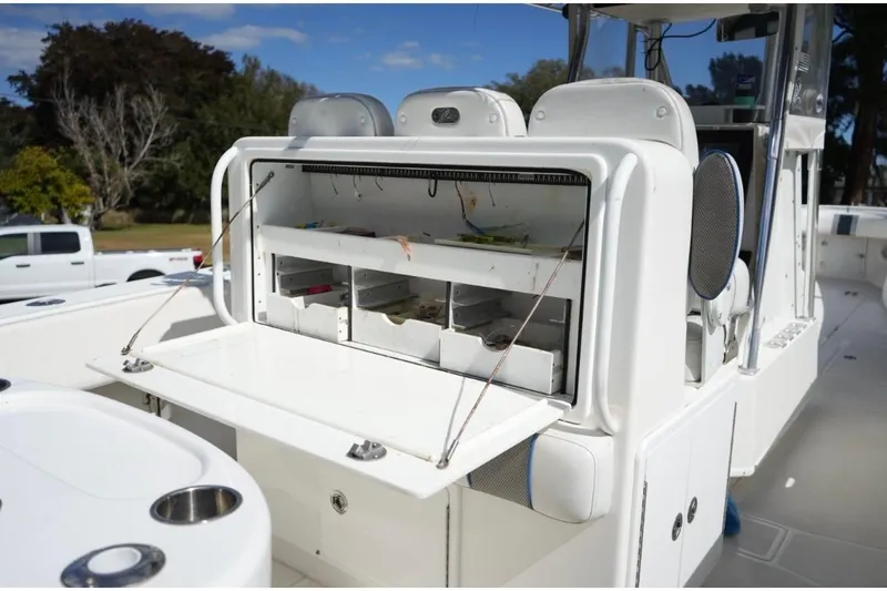 Slide: The Image of 2000 Contender 36 Open boat with open storage compartment and seating. - 10