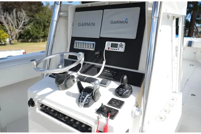 Slide: The Image of Center console of a 2000 Contender 36 Open boat with Garmin electronics. - 13