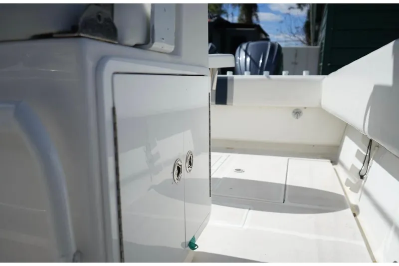 Slide: The Image of 2000 Contender 36 Open boat interior with storage compartment and seating. - 17