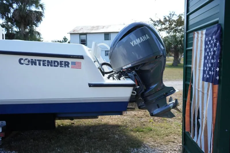 Slide: The Image of 2000 Contender 36 Open boat with Yamaha engine, American flag detail. - 3