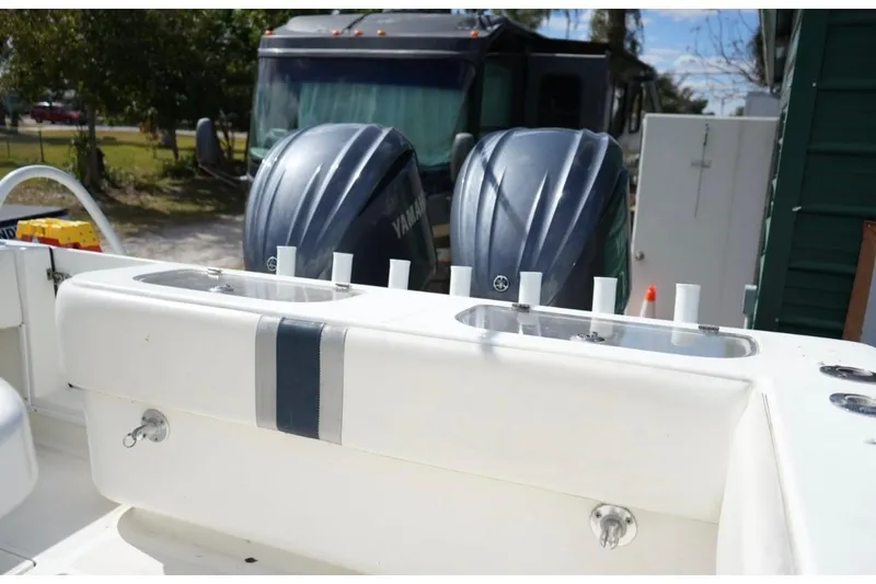 Slide: The Image of 2000 Contender 36 Open boat with dual Yamaha outboard engines, docked outdoors. - 8