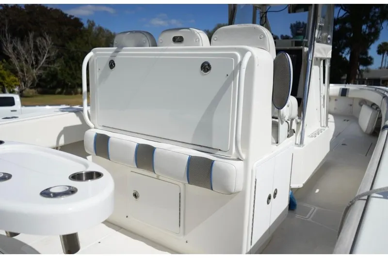 Slide: The Image of 2000 Contender 36 Open boat interior with seating and storage compartments. - 9