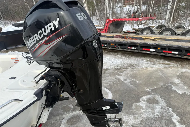 Slide: The Image of 2016 Mako Pro Skiff 17 CC with Mercury 60 FourStroke engine in snowy setting. - 29