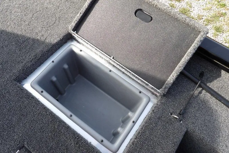Slide: The Image of 2026 Crestliner XF 189 boat storage compartment with open lid, showcasing interior space. - 11