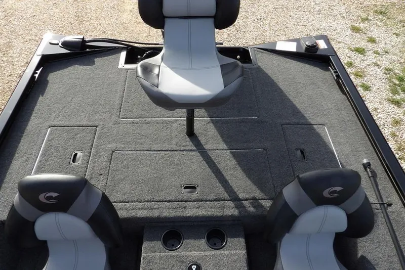 Slide: The Image of 2026 Crestliner XF 189 boat interior with gray seating and carpeted deck. - 15