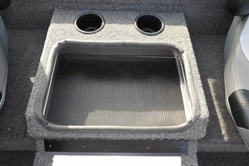 Slide: The Image of 2026 Crestliner XF 189 boat interior with cup holders and storage compartment. - 19
