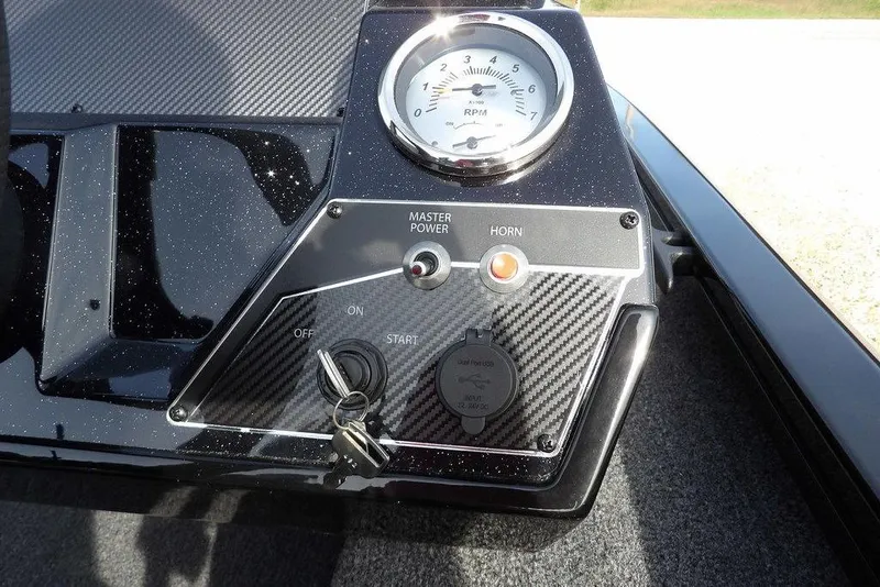 Slide: The Image of Control panel of 2026 Crestliner XF 189 boat with RPM gauge and ignition key. - 23
