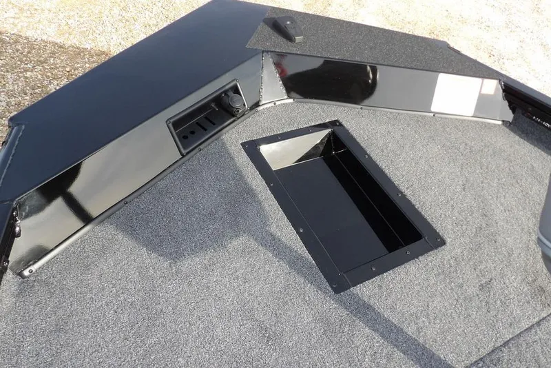 Slide: The Image of 2026 Crestliner XF 189 boat deck with storage compartment and sleek design. - 24