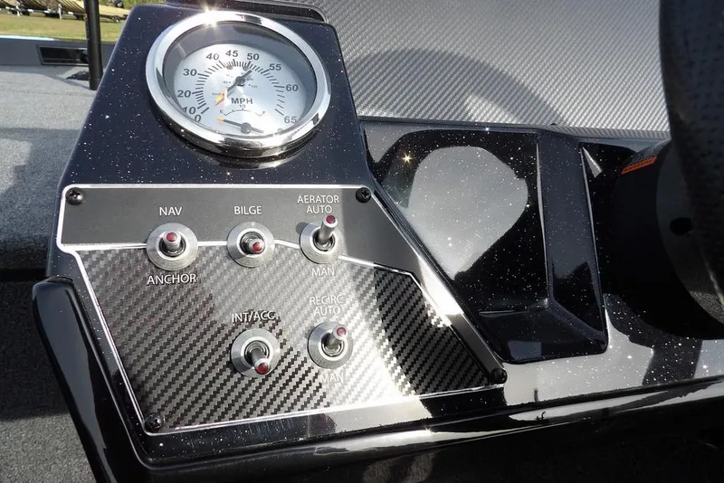 Slide: The Image of 2026 Crestliner XF 189 dashboard with speedometer and control switches. - 26
