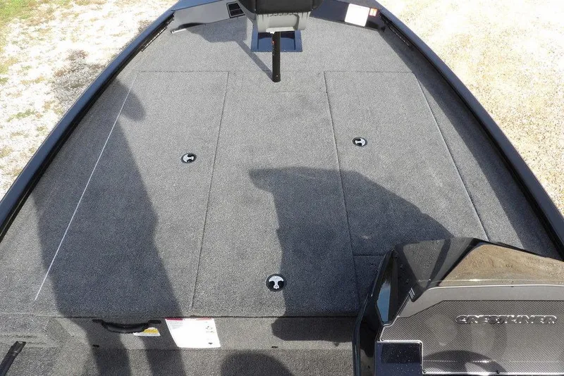 Slide: The Image of 2026 Crestliner XF 189 boat deck with carpeted surface and storage compartments. - 27