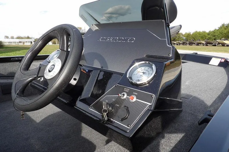 Slide: The Image of 2026 Crestliner XF 189 boat dashboard with steering wheel and gauges. - 31