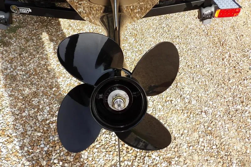 Slide: The Image of 2026 Crestliner XF 189 boat propeller on gravel surface. - 34