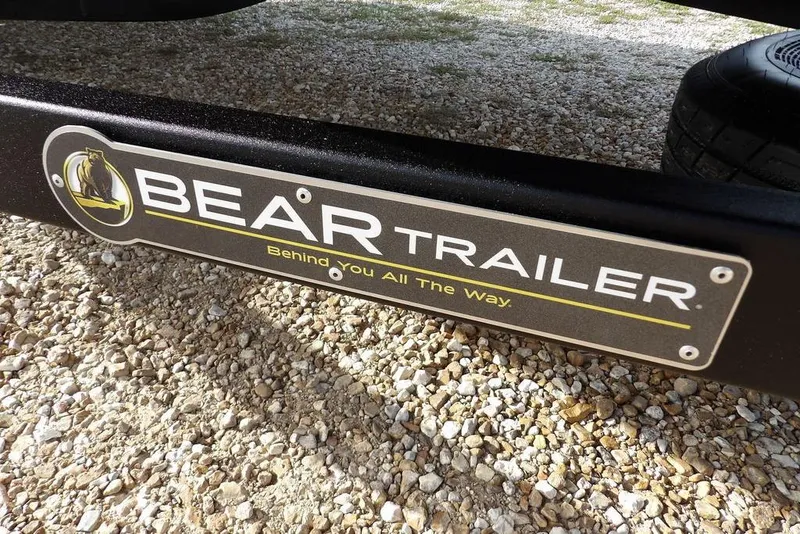 Slide: The Image of Bear Trailer logo on gravel, featuring "Behind You All The Way" slogan. Crestliner XF 189, 2026. - 36