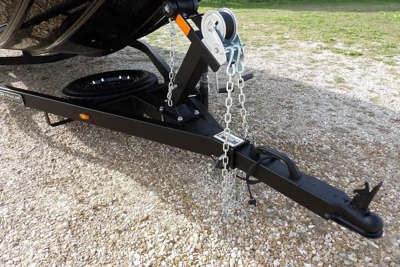 Slide: The Image of Trailer hitch and chains of 2026 Crestliner XF 189 on gravel surface. - 38