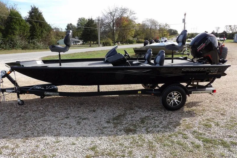 Slide: The Image of 2026 Crestliner XF 189 boat on trailer, parked outdoors, side view. - 7