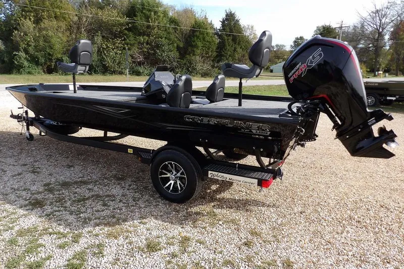 Slide: The Image of 2026 Crestliner XF 189 boat with outboard motor on gravel lot. - 8