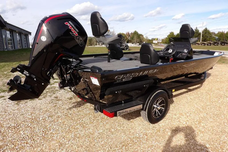 Slide: The Image of 2026 Crestliner XF 189 boat with Mercury Pro XS engine on a trailer, outdoors. - 9