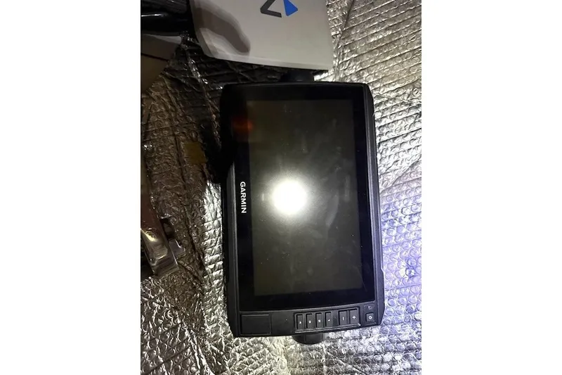 Slide: The Image of Garmin marine device on reflective surface, Nonsuch 30 Ultra, 1985 model. - 10