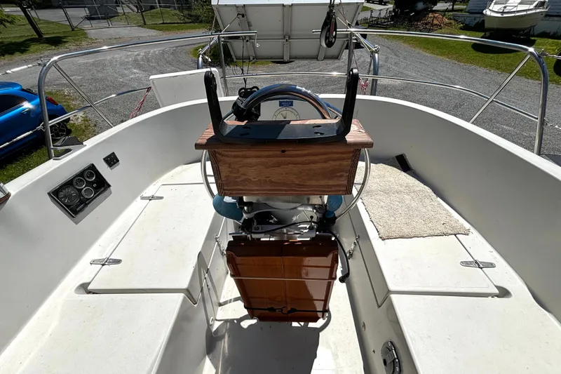 Slide: The Image of Cockpit of 1985 Nonsuch 30 Ultra sailboat with steering wheel and control panel. - 16