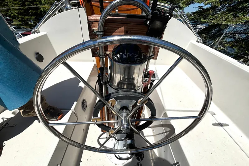 Slide: The Image of Steering wheel of a 1985 Nonsuch 30 Ultra sailboat, showcasing cockpit details. - 17