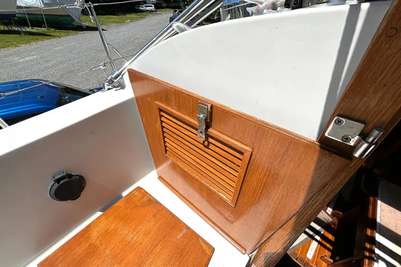 Slide: The Image of 1985 Nonsuch 30 Ultra sailboat cockpit with wooden hatch and latch detail. - 20