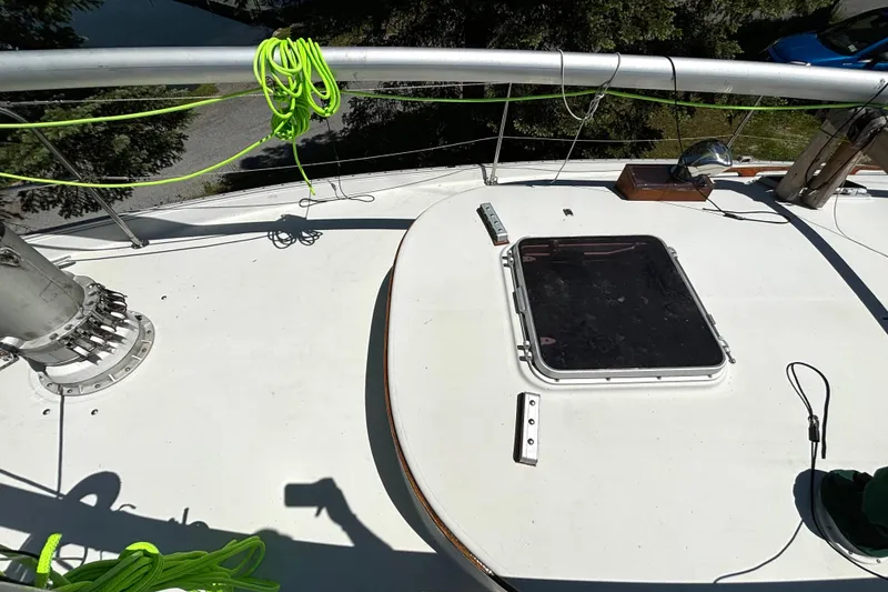Slide: The Image of Deck of 1985 Nonsuch 30 Ultra sailboat with bright green ropes and hatch. - 28