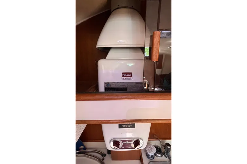 Slide: The Image of Interior of 1985 Nonsuch 30 Ultra sailboat featuring a Paloma water heater. - 38