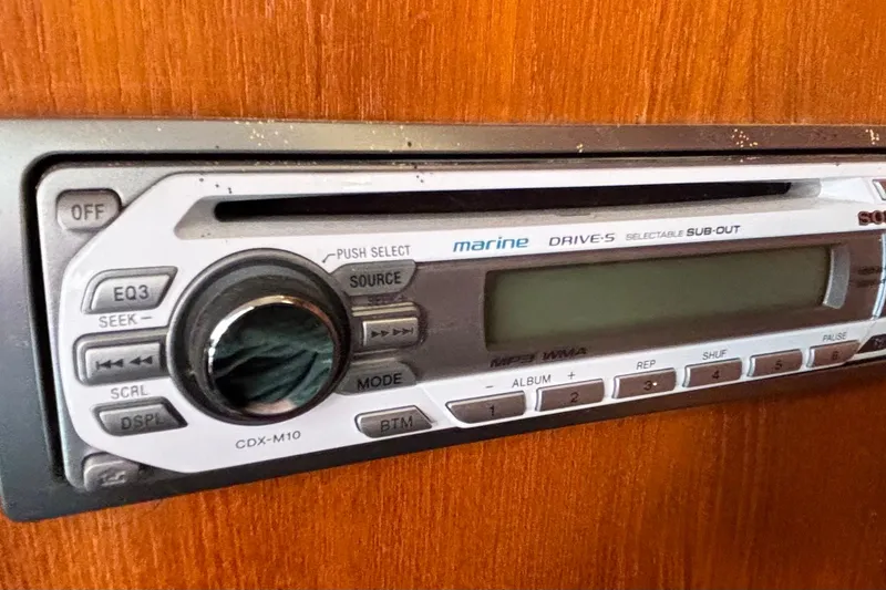 Slide: The Image of Marine stereo system in a 1985 Nonsuch 30 Ulta sailboat, featuring CDX-M10 model. - 48