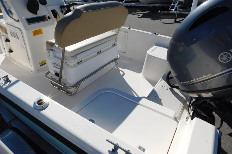 Slide: The Image of 2019 Key West 1720 Center Console boat interior with seating and Yamaha outboard motor. - 11