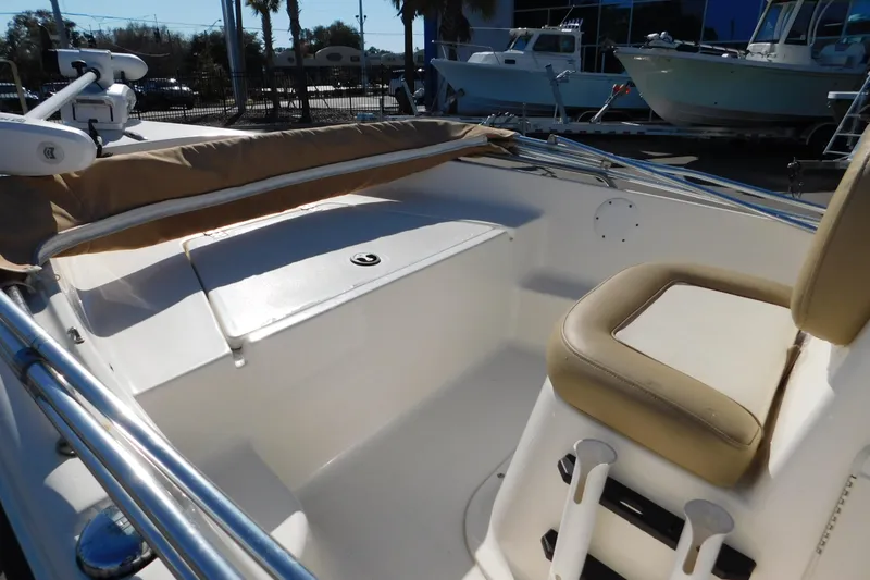 Slide: The Image of 2019 Key West 1720 Center Console boat interior with seating and storage. - 12