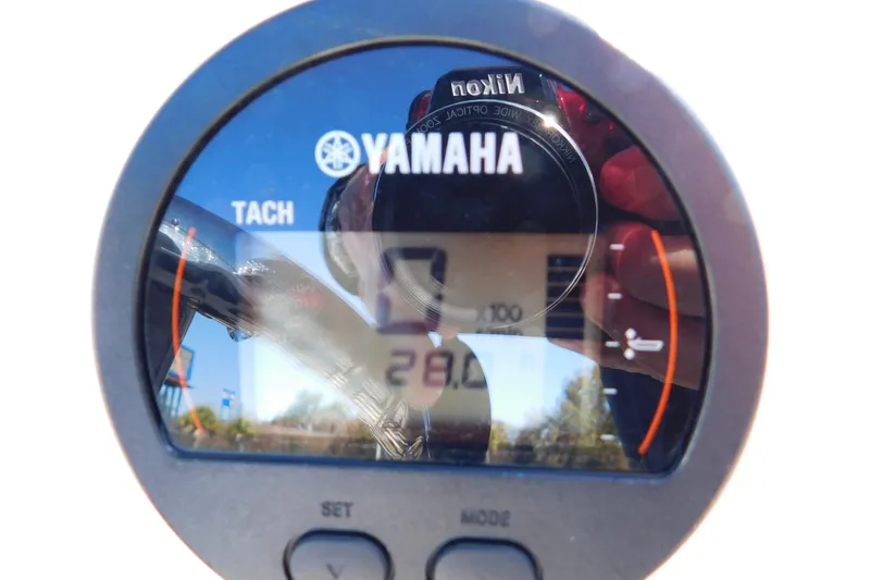Slide: The Image of Yamaha tachometer on 2019 Key West 1720 Center Console boat, reflecting outdoor scenery. - 18